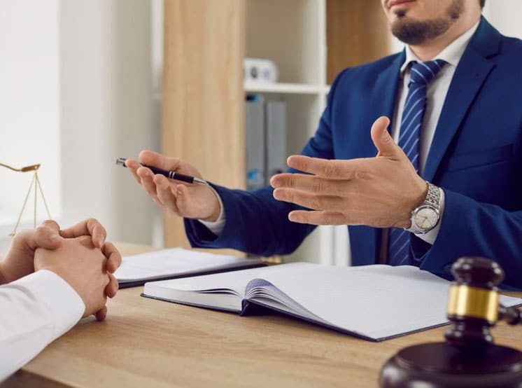 Lawyer Explaining Documents To Client — Dispute Resolution in Port Macquarie, NSW