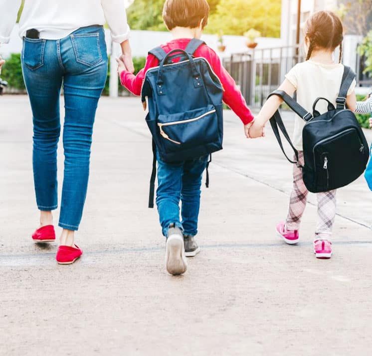 Mother Holding Her Kids Hands On The Way To School — Dispute Resolution in Port Macquarie, NSW